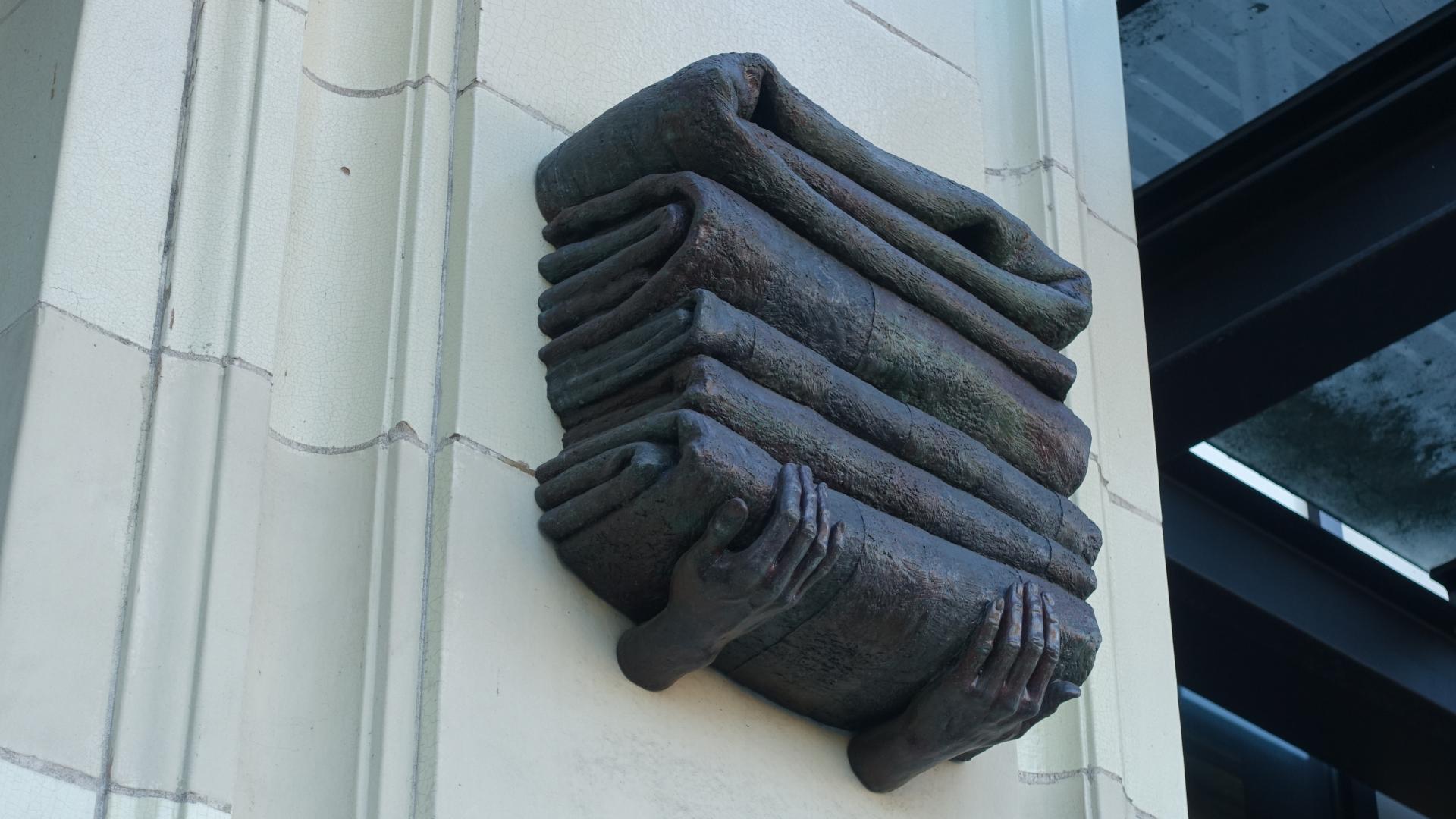 Hands of Time: Carrying Point Blankets Sculpture by Crystal Przybille