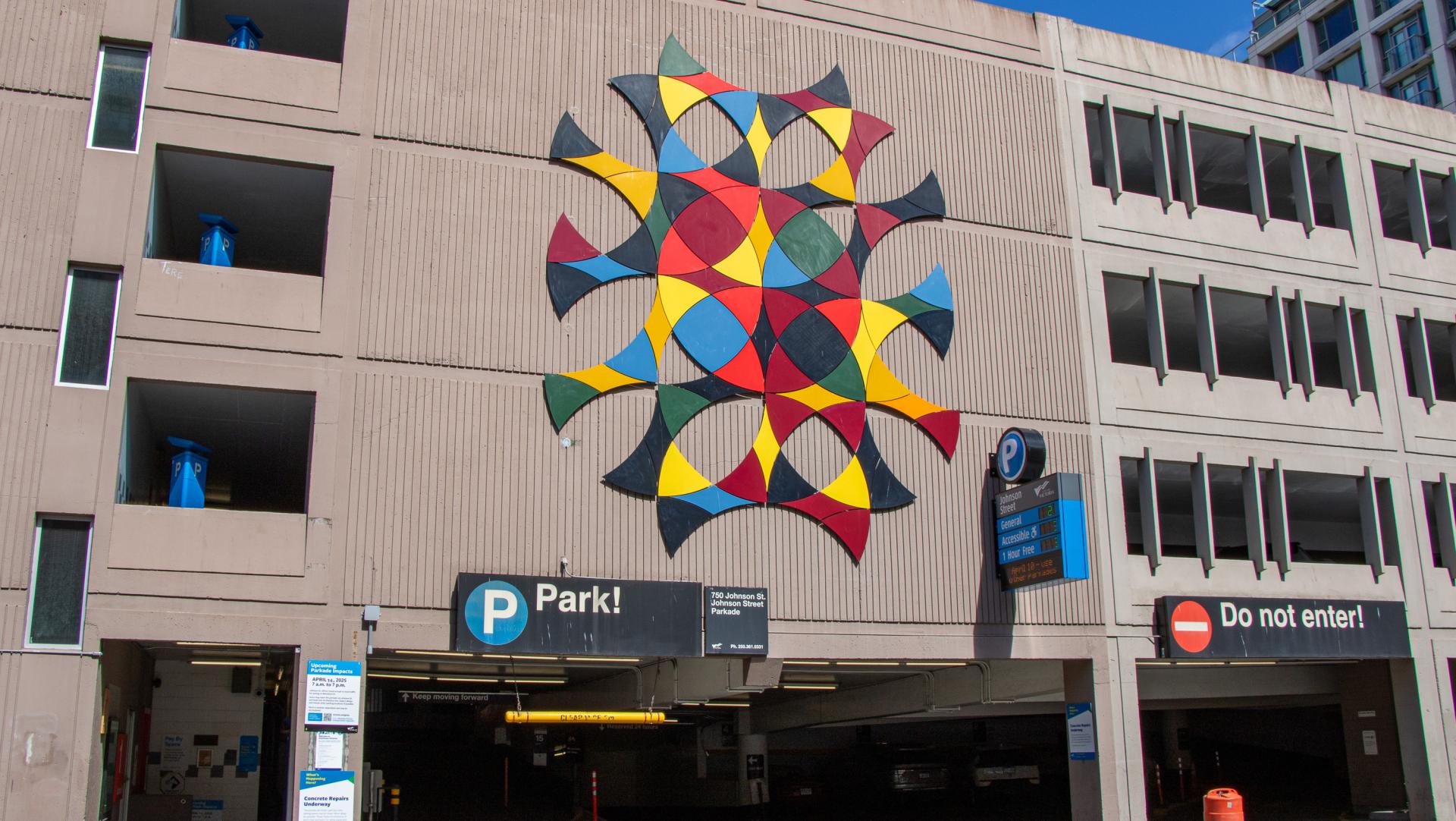 "Woven Together" by Susan Point and Thomas Cannell on the wall of Johnson Street Parkade.