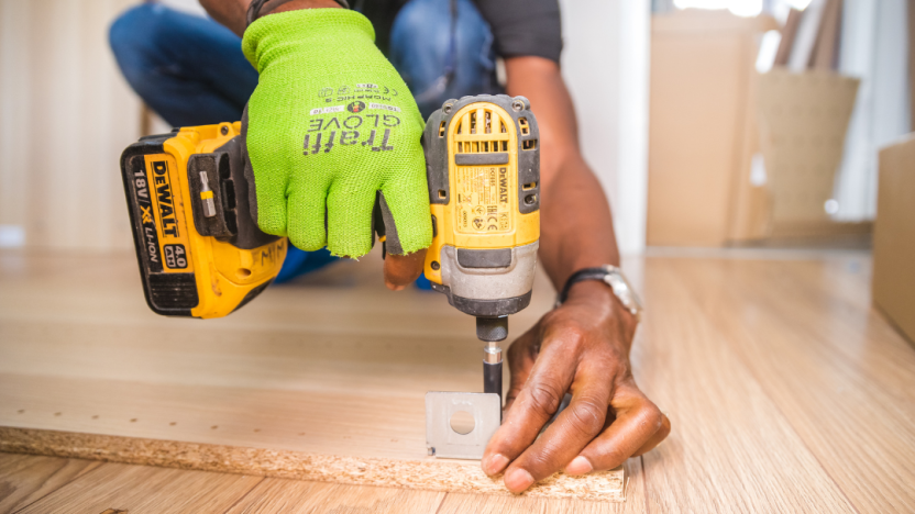 photo of a person using a battery powered drill