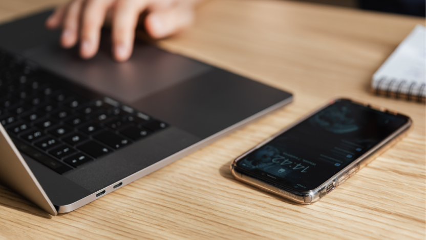 laptop and cell phone on a table