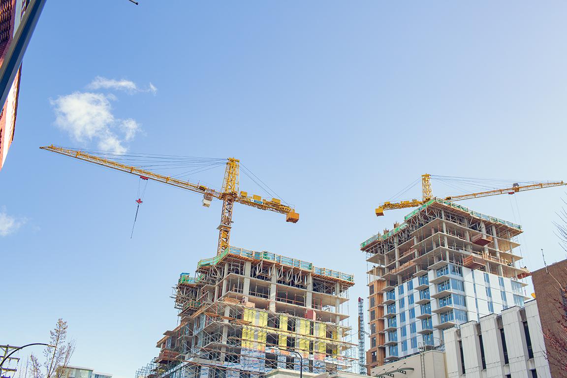 Buildings being constructed with cranes